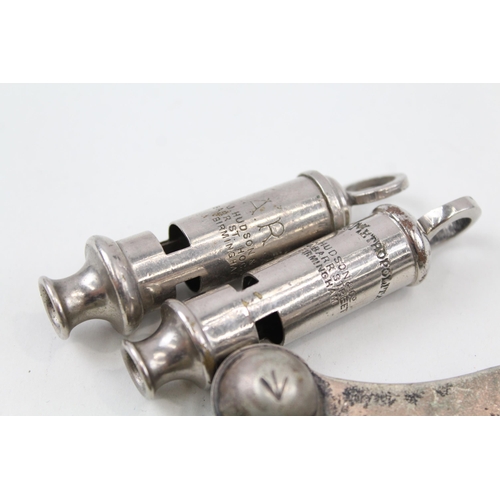 2272 - Six vintage whistles to include 1942 military, Bosuns, ARP, Metropolitan Police etc.