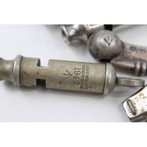 2272 - Six vintage whistles to include 1942 military, Bosuns, ARP, Metropolitan Police etc.