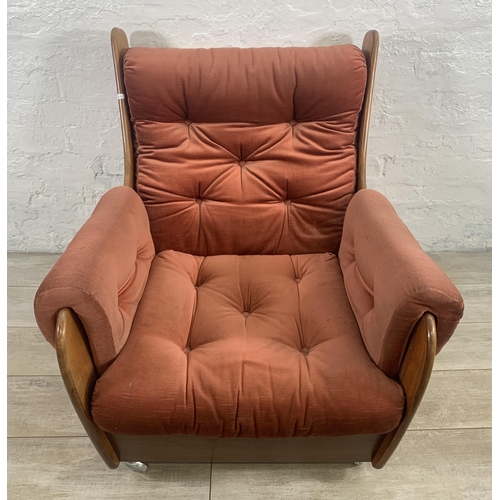 1 - A mid 20th century G Plan teak and fabric upholstered saddleback armchair on castors - approx. 83cm ... 