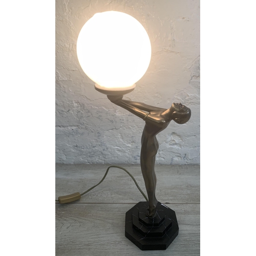 10 - An Art Deco style bronzed nude lady figural table lamp with opaque spherical shade and marble effect... 