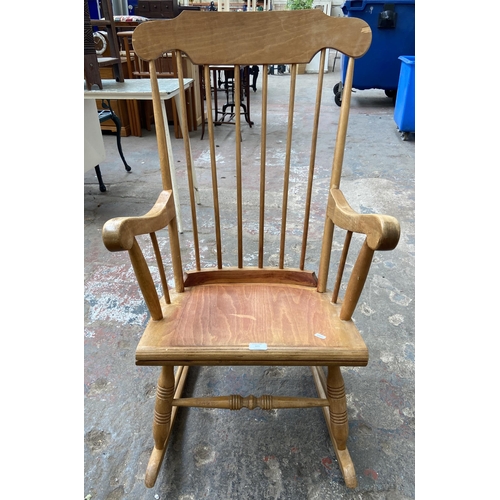 103 - A Victorian style beech spindle back farmhouse rocking chair