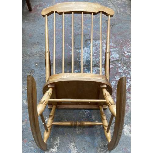 103 - A Victorian style beech spindle back farmhouse rocking chair