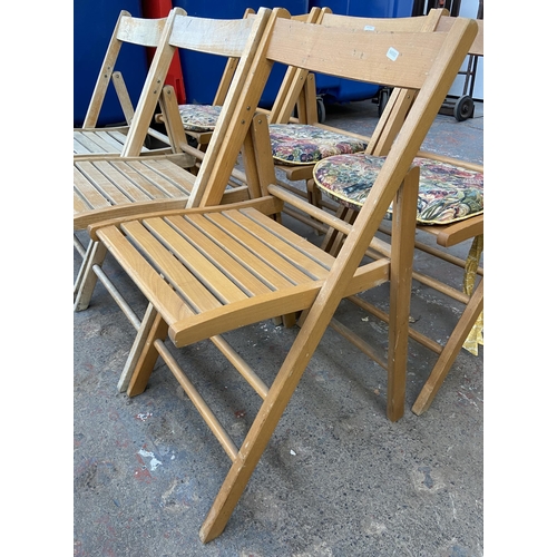 110 - Six beech folding chairs