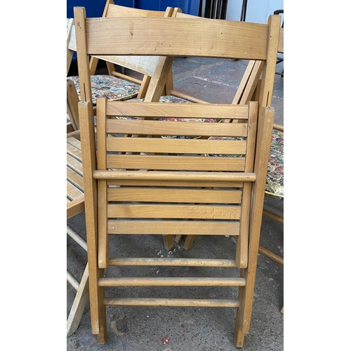 110 - Six beech folding chairs