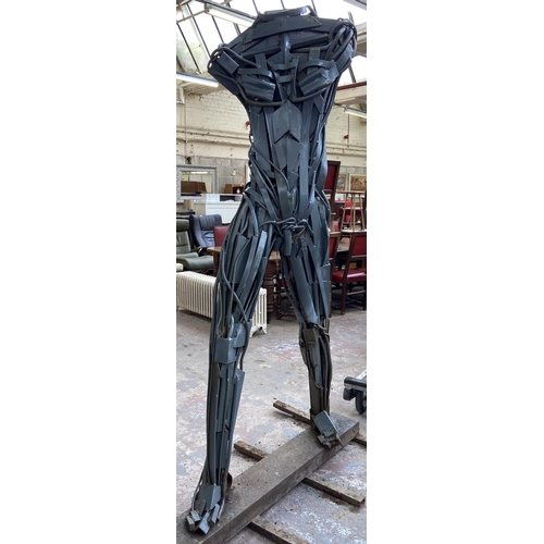 112A - A Neil Wood metal nude male sculpture - approx. 210cm high x 144cm wide x 95cm deep