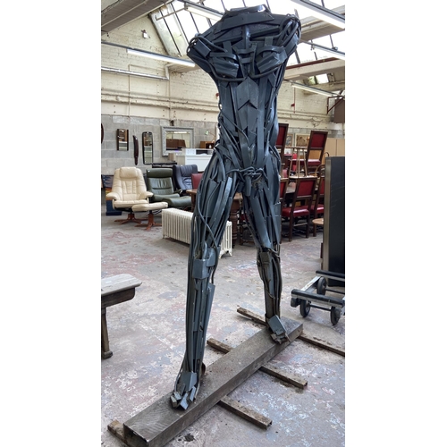 112A - A Neil Wood metal nude male sculpture - approx. 210cm high x 144cm wide x 95cm deep