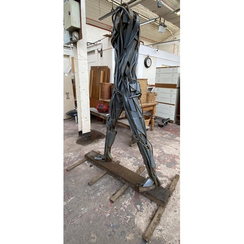 112A - A Neil Wood metal nude male sculpture - approx. 210cm high x 144cm wide x 95cm deep