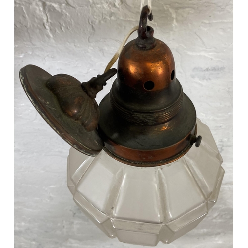 114 - An early 20th century copper and frosted glass pendant light - approx. 36cm high