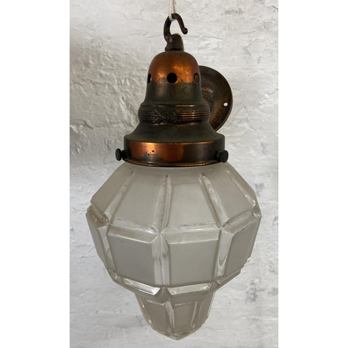 114 - An early 20th century copper and frosted glass pendant light - approx. 36cm high