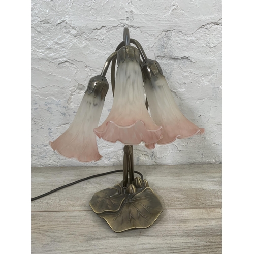 12 - An Art Nouveau style bronzed lily pad table lamp with three pink and white mottled glass shades - ap... 