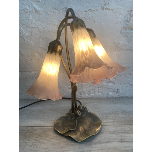 12 - An Art Nouveau style bronzed lily pad table lamp with three pink and white mottled glass shades - ap... 