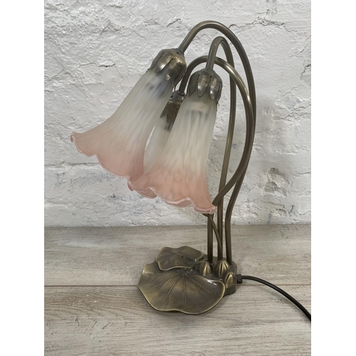 12 - An Art Nouveau style bronzed lily pad table lamp with three pink and white mottled glass shades - ap... 