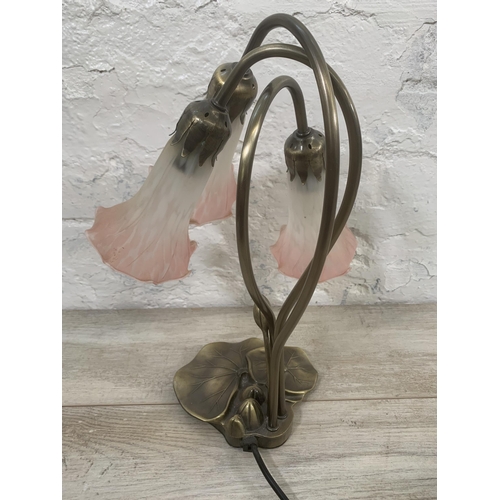 12 - An Art Nouveau style bronzed lily pad table lamp with three pink and white mottled glass shades - ap... 