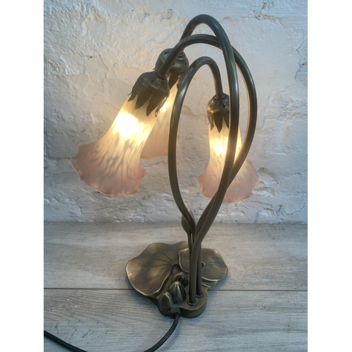 12 - An Art Nouveau style bronzed lily pad table lamp with three pink and white mottled glass shades - ap... 