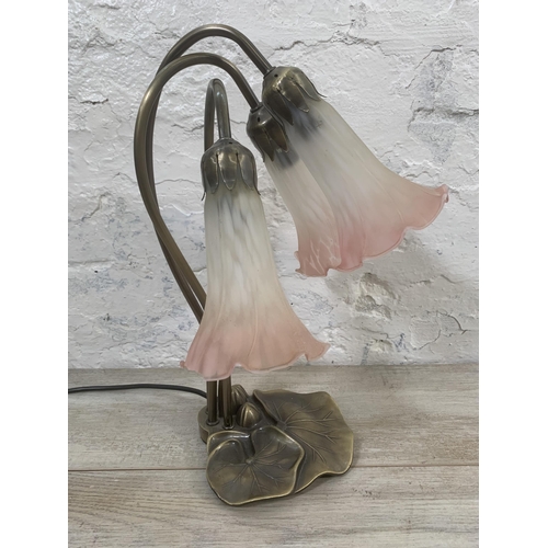 12 - An Art Nouveau style bronzed lily pad table lamp with three pink and white mottled glass shades - ap... 