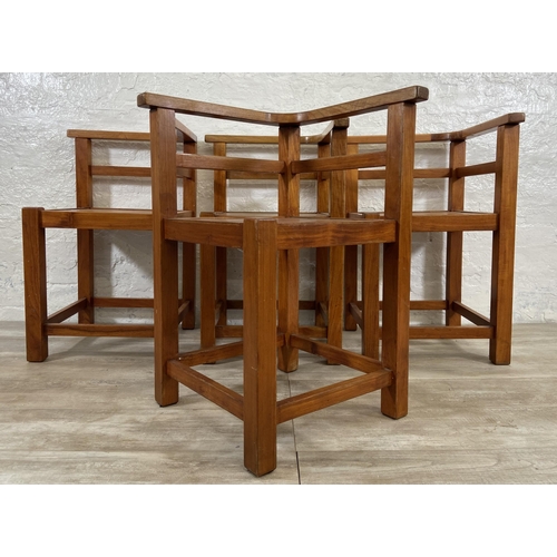 125 - Four teak outdoor corner chairs - approx. 74cm high