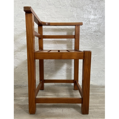 125 - Four teak outdoor corner chairs - approx. 74cm high