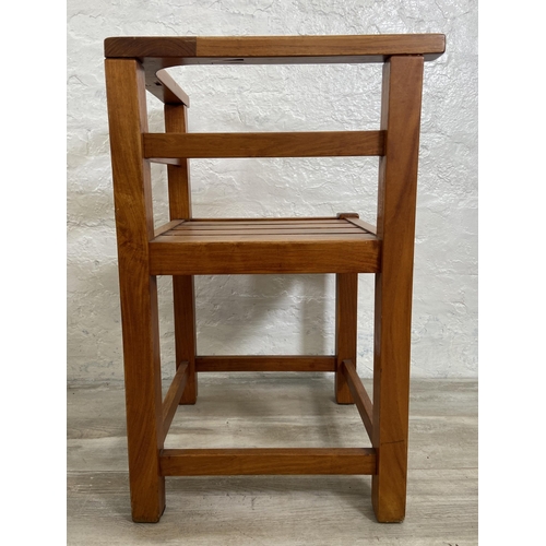 125 - Four teak outdoor corner chairs - approx. 74cm high