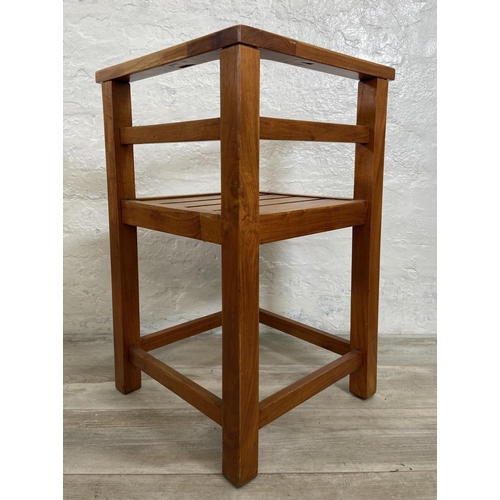 125 - Four teak outdoor corner chairs - approx. 74cm high