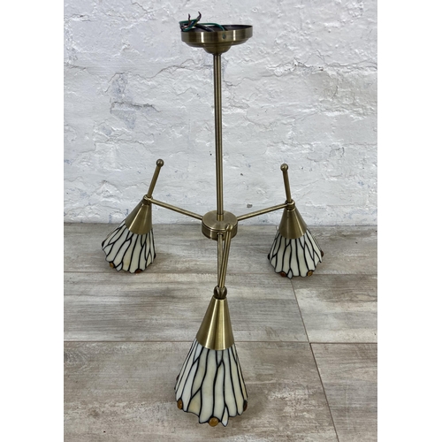 126 - Four pieces of Tiffany style brushed brass effect and stained glass lighting, two chandeliers and tw... 