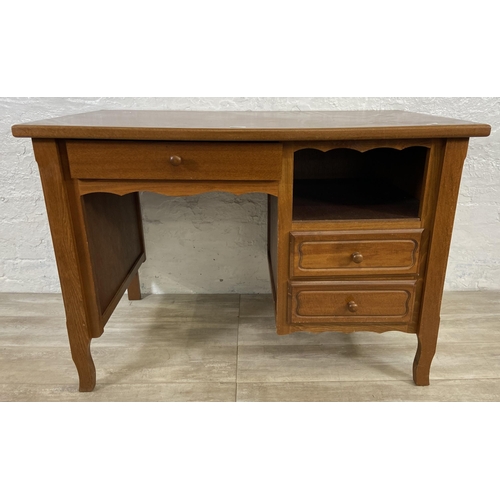 127 - A beech office desk - approx. 77cm high x 110cm wide x 64cm deep