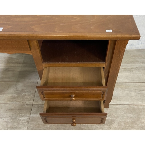 127 - A beech office desk - approx. 77cm high x 110cm wide x 64cm deep