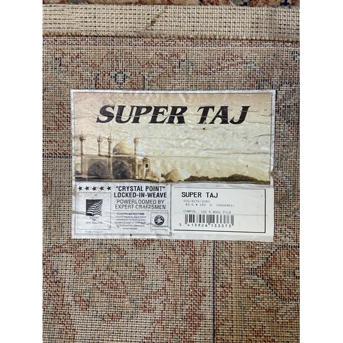 13 - A Wools of New Zealand Super Taj 100% wool pile floral pattern rug - approx. 156cm x 83cm