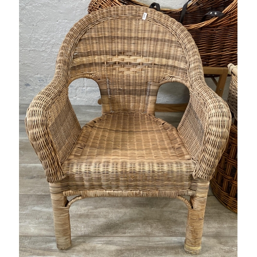 134 - Nine pieces of wicker furniture to include armchair, Moses basket etc.