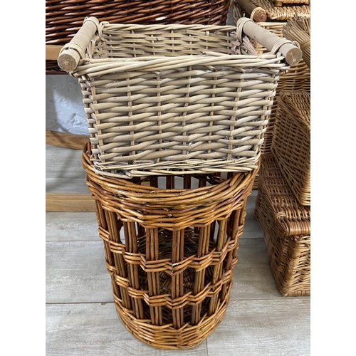 134 - Nine pieces of wicker furniture to include armchair, Moses basket etc.