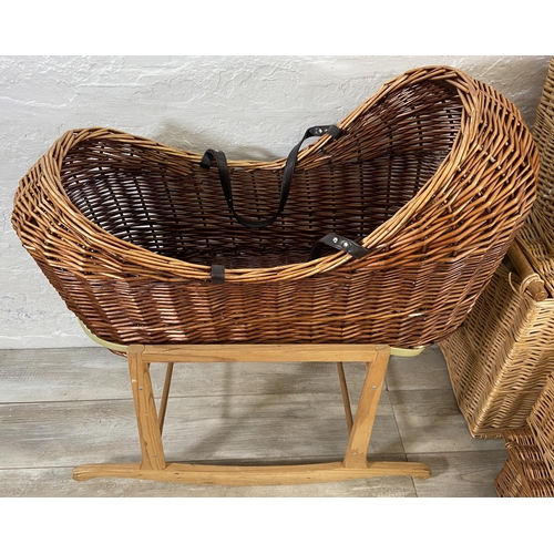 134 - Nine pieces of wicker furniture to include armchair, Moses basket etc.