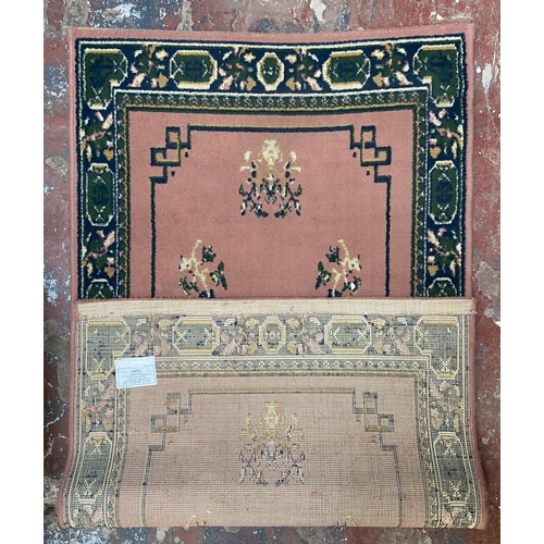 13A - A Kashan 100% polypropylene pink ground rug - approx. 150cm x 82cm