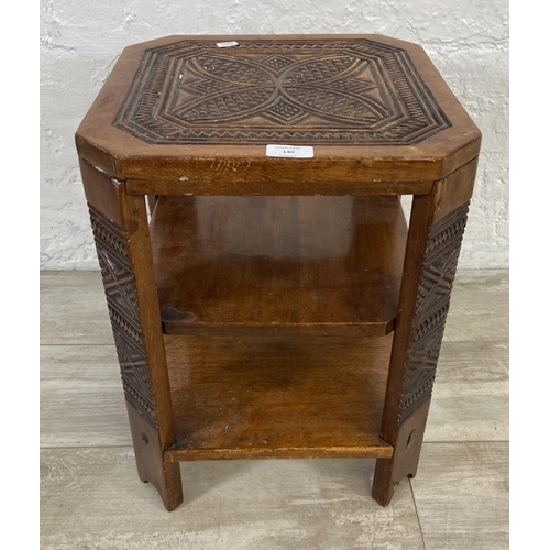 140 - A 1930s carved wood octagonal three tier side table - approx. 48cm high x 35cm wide x 35cm deep