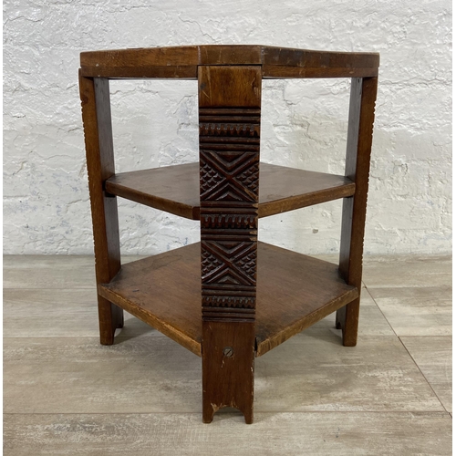 140 - A 1930s carved wood octagonal three tier side table - approx. 48cm high x 35cm wide x 35cm deep