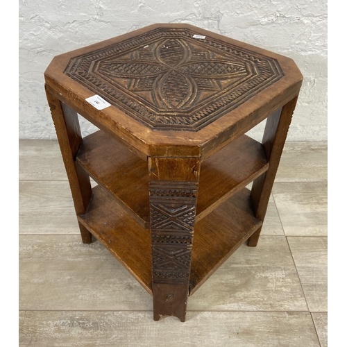 140 - A 1930s carved wood octagonal three tier side table - approx. 48cm high x 35cm wide x 35cm deep