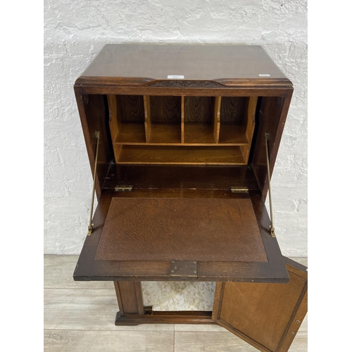 141 - An Art Deco oak bureau - approx. 108cm high x 56cm wide x 33cm deep