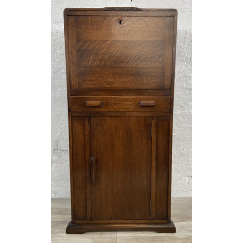 141 - An Art Deco oak bureau - approx. 108cm high x 56cm wide x 33cm deep