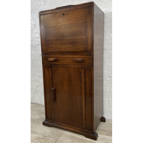 141 - An Art Deco oak bureau - approx. 108cm high x 56cm wide x 33cm deep