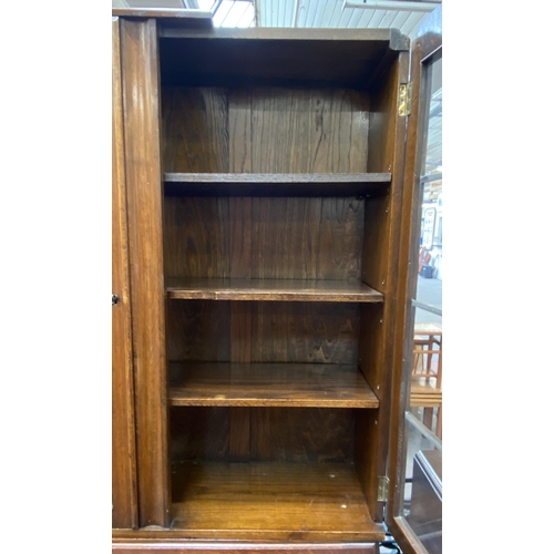 142 - An Art Deco carved oak bureau bookcase on baluster supports - approx. 198cm high x 91cm wide x 42cm ... 