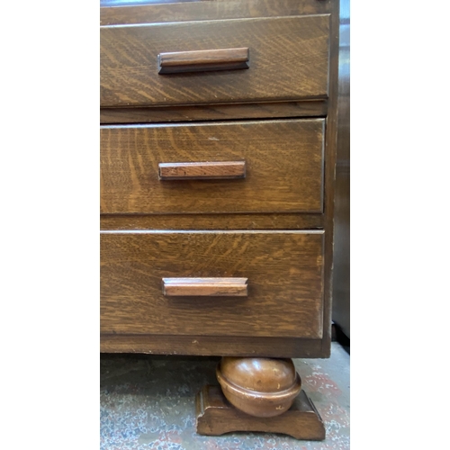 142 - An Art Deco carved oak bureau bookcase on baluster supports - approx. 198cm high x 91cm wide x 42cm ... 