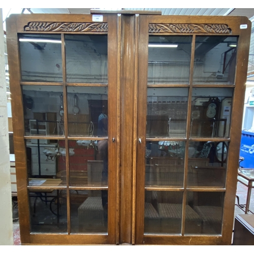 142 - An Art Deco carved oak bureau bookcase on baluster supports - approx. 198cm high x 91cm wide x 42cm ... 