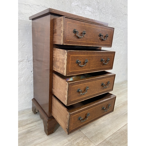 148 - A Georgian style inlaid mahogany miniature chest of drawers on bracket supports - approx. 74cm high ... 