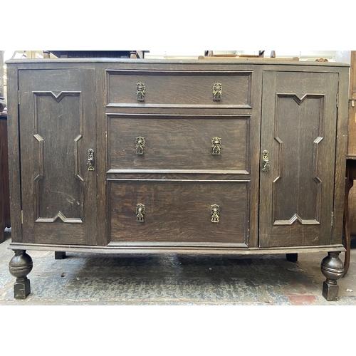 152 - An early 20th century carved oak sideboard - approx. 104cm high x 130cm wide x 48cm deep