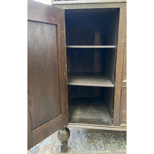 152 - An early 20th century carved oak sideboard - approx. 104cm high x 130cm wide x 48cm deep