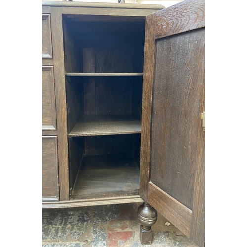 152 - An early 20th century carved oak sideboard - approx. 104cm high x 130cm wide x 48cm deep