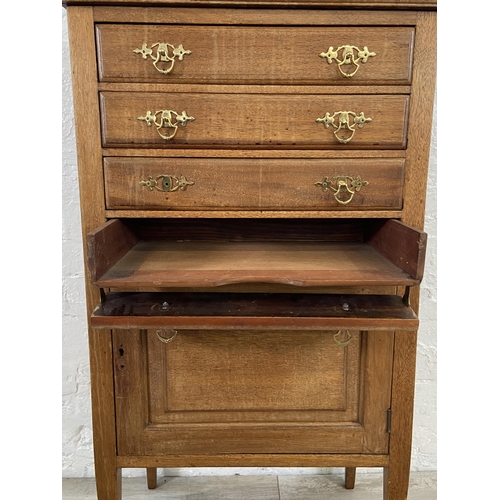 153 - An Edwardian mahogany four drawer music cabinet - approx. 110cm high x 55cm wide x 38cm deep