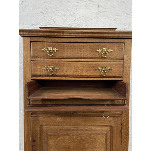 153 - An Edwardian mahogany four drawer music cabinet - approx. 110cm high x 55cm wide x 38cm deep