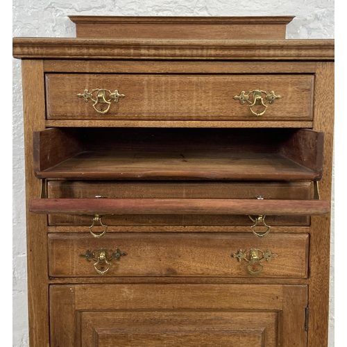 153 - An Edwardian mahogany four drawer music cabinet - approx. 110cm high x 55cm wide x 38cm deep