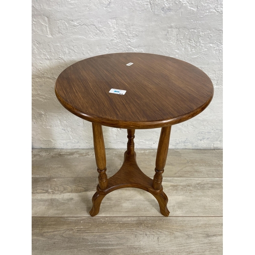 155 - Six pieces of furniture, one beech circular side table, one pine side table, one oak side table, one... 