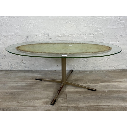 157 - A mid 20th century glass top oval coffee table - approx. 39cm high x 43cm wide x 98cm long