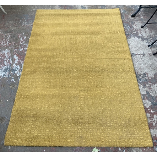 16 - Two modern machine woven rugs, one Dunelm Traditional Multi Brights - approx. 170cm x 120cm and one ... 